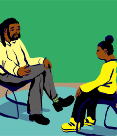 Adult and a youth sitting across from each other
