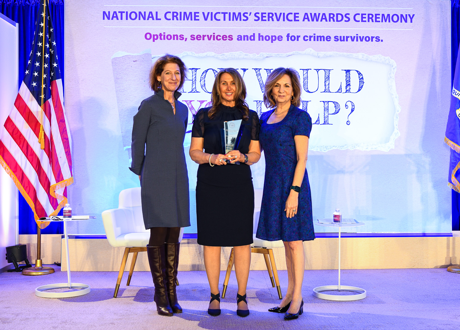 Michelle S. Ballan, Ph.D., MSW receives the 2024 Building Knowledge Through Research Award with (from left) OVC Director Kristina Rose and Assistant Attorney General Amy L. Solomon.