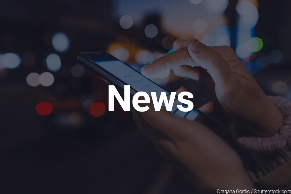Text: News Image: Person on their cellphone